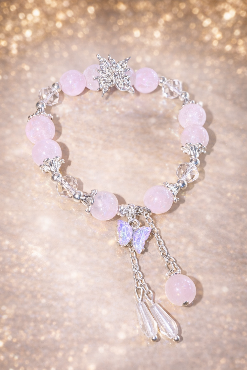 Glasperlenarmband rosa-flieder mit Schmetterlingen und kettchen Strass