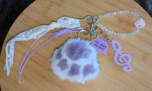 Taschenbaumler mit Lila Plüschtatze Tatze